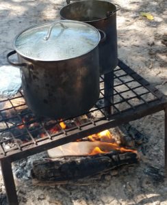 A drawing is burned on the campfire to rid bad feelings.