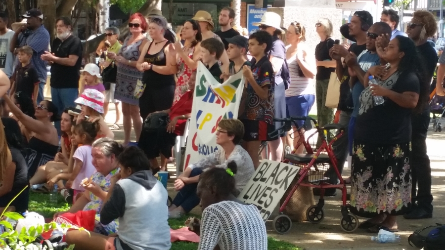 Children hold a banner protesting the treatment of children like them in juvenile detention